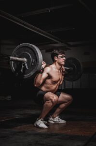 Photo of Man Lifting Barbell